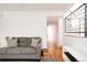 Living area with hardwood floors and a view down a hallway at 2719 S Truckee St, Aurora, CO 80013