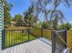 Backyard deck overlooking a grass yard with a wooden privacy fence at 9540 King Way, Westminster, CO 80031