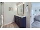 Elegant bathroom featuring a double sink vanity, modern fixtures, and stylish decor with a walk in shower at 9540 King Way, Westminster, CO 80031