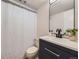 Well-lit bathroom features a sleek vanity, modern fixtures, and a shower at 9540 King Way, Westminster, CO 80031