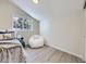 Bright bedroom with a comfy beanbag chair, clean walls, and natural light from the window at 9540 King Way, Westminster, CO 80031