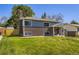 Charming two-story home with brick exterior, well-maintained lawn, and mature trees at 9540 King Way, Westminster, CO 80031