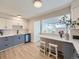 Bright kitchen featuring stylish two-tone cabinets, stainless steel appliances, and a breakfast bar at 9540 King Way, Westminster, CO 80031