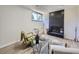 Cozy basement living room with a fireplace, comfortable seating, and stylish accents at 9540 King Way, Westminster, CO 80031