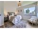 Cozy main bedroom featuring natural light and hardwood floors, creating a warm and inviting space at 9540 King Way, Westminster, CO 80031