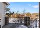 Private balcony overlooking a tranquil lake and trees at 8965 E Phillips Dr, Centennial, CO 80112