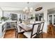 Bright dining area featuring a large dining table surrounded by windows and flooded with natural light at 7142 S Hudson Ln, Centennial, CO 80122