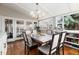 Bright dining area featuring a large dining table surrounded by windows and flooded with natural light at 7142 S Hudson Ln, Centennial, CO 80122
