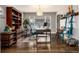 Well-lit home office featuring modern desk, stylish decor, hardwood floors, and bright light at 7142 S Hudson Ln, Centennial, CO 80122