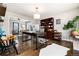 Spacious home office with hardwood floors, a large desk, and built-in shelving at 7142 S Hudson Ln, Centennial, CO 80122