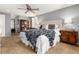 Relaxing main bedroom with decorative furnishings, soft lighting, and a large bed at 7142 S Hudson Ln, Centennial, CO 80122