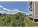 Building with a covered deck overlooking a natural grassy area at 1135 S Gilbert St # 103, Castle Rock, CO 80104
