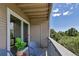 Inviting balcony with outdoor storage, offering a serene view of lush greenery and blue skies at 1135 S Gilbert St # 103, Castle Rock, CO 80104