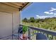 Relaxing balcony space with comfortable seating overlooking the neighborhood and greenery at 1135 S Gilbert St # 103, Castle Rock, CO 80104
