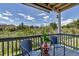 Cozy balcony with seating, offering a serene view of the surrounding greenery and neighborhood homes at 1135 S Gilbert St # 103, Castle Rock, CO 80104