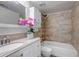 Bathroom with shower over tub, tile surround, neutral countertop and orchid at 1135 S Gilbert St # 103, Castle Rock, CO 80104