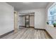 Bedroom with an open closet, bright window and wood-look flooring at 1135 S Gilbert St # 103, Castle Rock, CO 80104