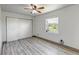 Bright, airy bedroom featuring wood-look flooring, large closet and a window with pleasant view at 1135 S Gilbert St # 103, Castle Rock, CO 80104