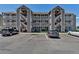 Apartment building featuring private entrances, covered parking, and landscaped grounds at 1135 S Gilbert St # 103, Castle Rock, CO 80104