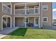 Home exterior featuring a cozy front porch and a well-maintained lawn at 1135 S Gilbert St # 103, Castle Rock, CO 80104