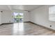Bright living area with sliding glass doors that open to a balcony with seating and views at 1135 S Gilbert St # 103, Castle Rock, CO 80104