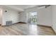 Open living area featuring a balcony with sliding glass doors, providing natural light and outdoor access at 1135 S Gilbert St # 103, Castle Rock, CO 80104