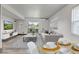 Bright living and dining area with modern furnishings, a view to the balcony, and a neutral color palette at 1135 S Gilbert St # 103, Castle Rock, CO 80104