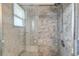 Close up of a stylish shower with detailed tile work and modern fixtures at 1135 S Gilbert St # 103, Castle Rock, CO 80104