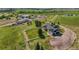 Sprawling ranch home with fenced yard and attached garage on a meticulously landscaped lot with verdant green lawns at 39681 Swift Creek Cir, Elizabeth, CO 80107