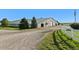 Large horse barn featuring multiple entries and well-maintained grounds for ease of horse care and maintenance at 39681 Swift Creek Cir, Elizabeth, CO 80107