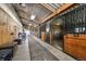 Spacious horse barn aisle featuring well-maintained stalls with ample space and storage, enhanced by good lighting at 39681 Swift Creek Cir, Elizabeth, CO 80107
