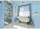 Elegant bathroom featuring a clawfoot tub, glass shower and contemporary finishes for a luxurious experience at 39681 Swift Creek Cir, Elizabeth, CO 80107