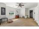 Bright bedroom with a ceiling fan, window overlooking green space and a walk-in closet at 39681 Swift Creek Cir, Elizabeth, CO 80107
