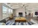 Living room with high ceilings, large windows and wood floors at 39681 Swift Creek Cir, Elizabeth, CO 80107