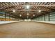 Large indoor riding arena with excellent lighting, a sand floor, and ample space for equestrian activities at 39681 Swift Creek Cir, Elizabeth, CO 80107