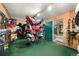 Well-organized tack room with saddle racks, bridle hooks, and ample storage for equestrian equipment at 39681 Swift Creek Cir, Elizabeth, CO 80107
