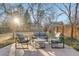 Backyard patio area with outdoor seating and a well-maintained lawn at 2201 Juniper Ct, Boulder, CO 80304