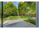 Landscaped backyard view showcasing a stone patio and pond feature, perfect for outdoor relaxation at 2201 Juniper Ct, Boulder, CO 80304