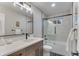 Charming bathroom with a shower and bathtub combination, wood-look vanity, and modern fixtures at 2201 Juniper Ct, Boulder, CO 80304