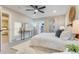 Stylish bedroom with a view to the bathroom, a ceiling fan and a stylish console table at 2201 Juniper Ct, Boulder, CO 80304