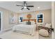 Bright bedroom featuring a large ceiling fan, a decorative basket on the wall, and two windows for ample natural light at 2201 Juniper Ct, Boulder, CO 80304