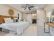 Contemporary bedroom featuring a sliding barn door, a ceiling fan, and a console table at 2201 Juniper Ct, Boulder, CO 80304