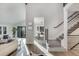 Bright and airy interior showcasing hardwood floors, modern staircase, and open-concept living space with abundant natural light at 2201 Juniper Ct, Boulder, CO 80304