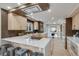 Modern kitchen with stone countertops, stainless appliances, kitchen island, and stylish barstool seating at 2201 Juniper Ct, Boulder, CO 80304