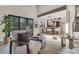 Open-concept living space seamlessly connects to dining and kitchen with hardwood floors, modern seating, and ample light at 2201 Juniper Ct, Boulder, CO 80304