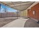 Covered patio with concrete, brick walls, and metal covering at 7180 Zuni St, Denver, CO 80221