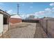 Gravel backyard with an enclosed area with a wooden fence at 7180 Zuni St, Denver, CO 80221