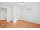 Bedroom with wood floors featuring a closet and neutral paint at 7180 Zuni St, Denver, CO 80221