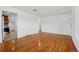 Open floor plan features hardwood floors, white walls, and abundant natural light at 7180 Zuni St, Denver, CO 80221