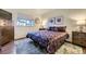 Cozy bedroom with decorative bedding, natural light, and comfortable furnishings at 5757 S Algonquian Way # E, Aurora, CO 80016